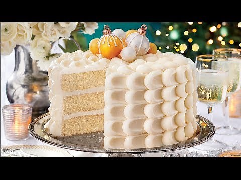 snowy-vanilla-cake-with-cream-cheese-buttercream image