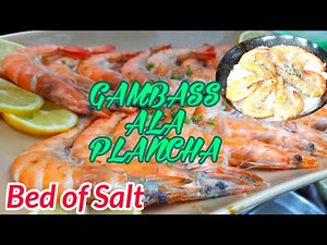 gambas-ala-plancha-on-a-bed-of-salt-spanish-grilled image