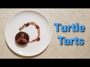 turtle-tarts-recipe-chocolate-caramel-pecan-tarts image