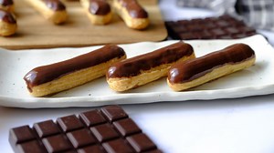 mini-chocolate-eclairs-recipe-tasting-table image