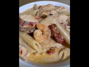 quick-and-easy-spicy-chicken-and-shrimp-pasta image